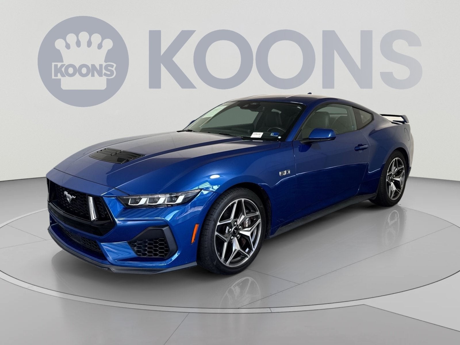2024 Ford Mustang GT in Blue Metallic — front three-quarter view