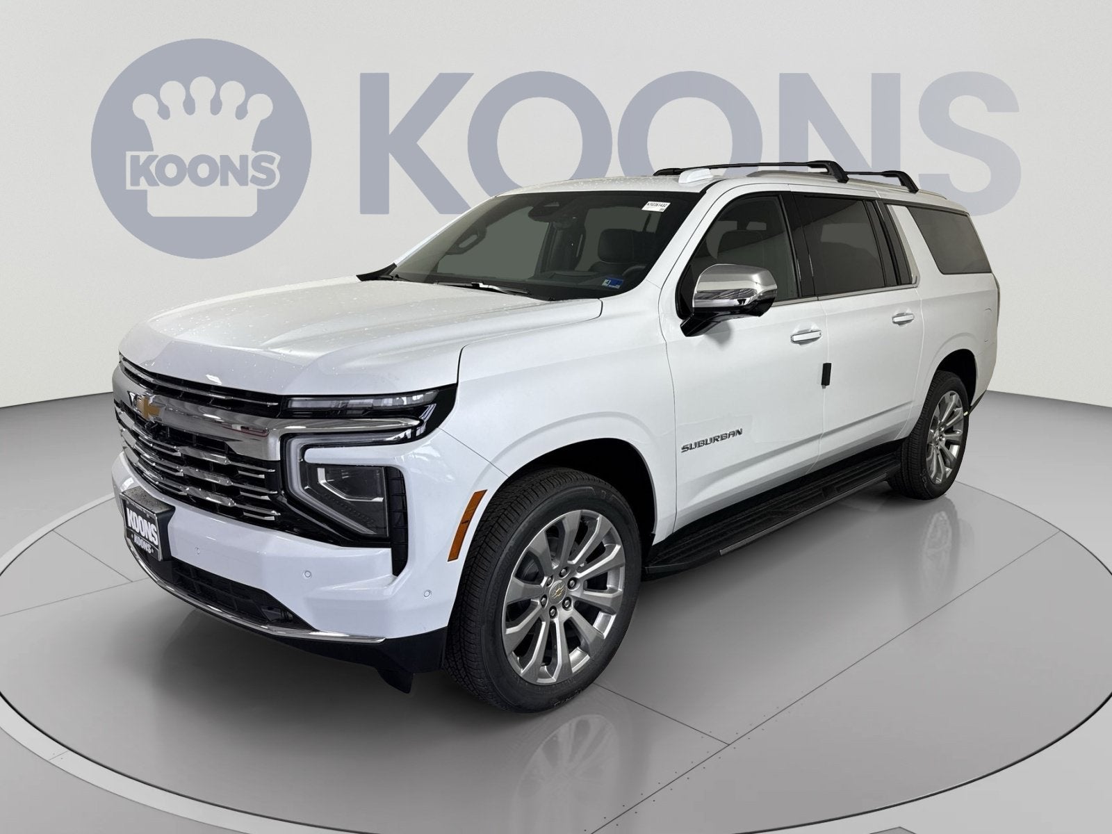 2026 Chevrolet Suburban Premier in Polar White Tricoat — front three-quarter view