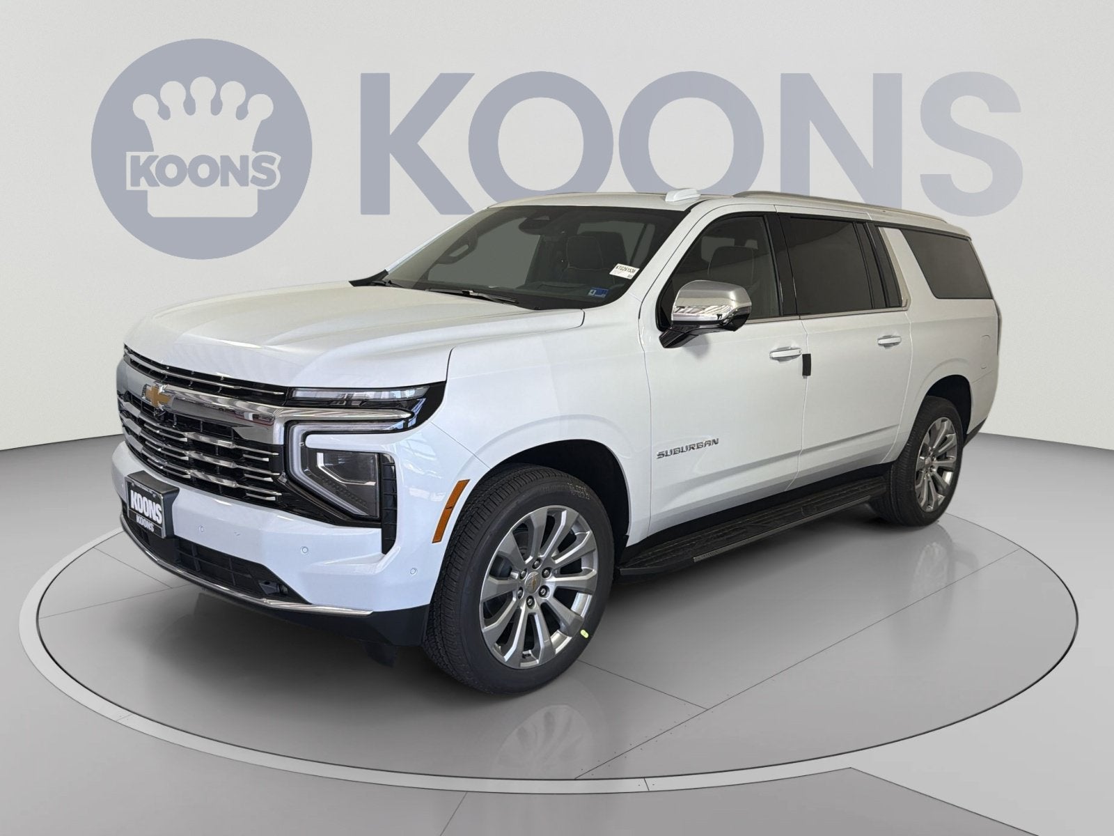 2026 Chevrolet Suburban Premier in Polar White Tricoat — front three-quarter view