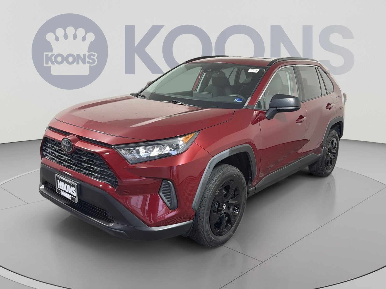 2021 Toyota RAV4 LE in Pearl — front three-quarter view