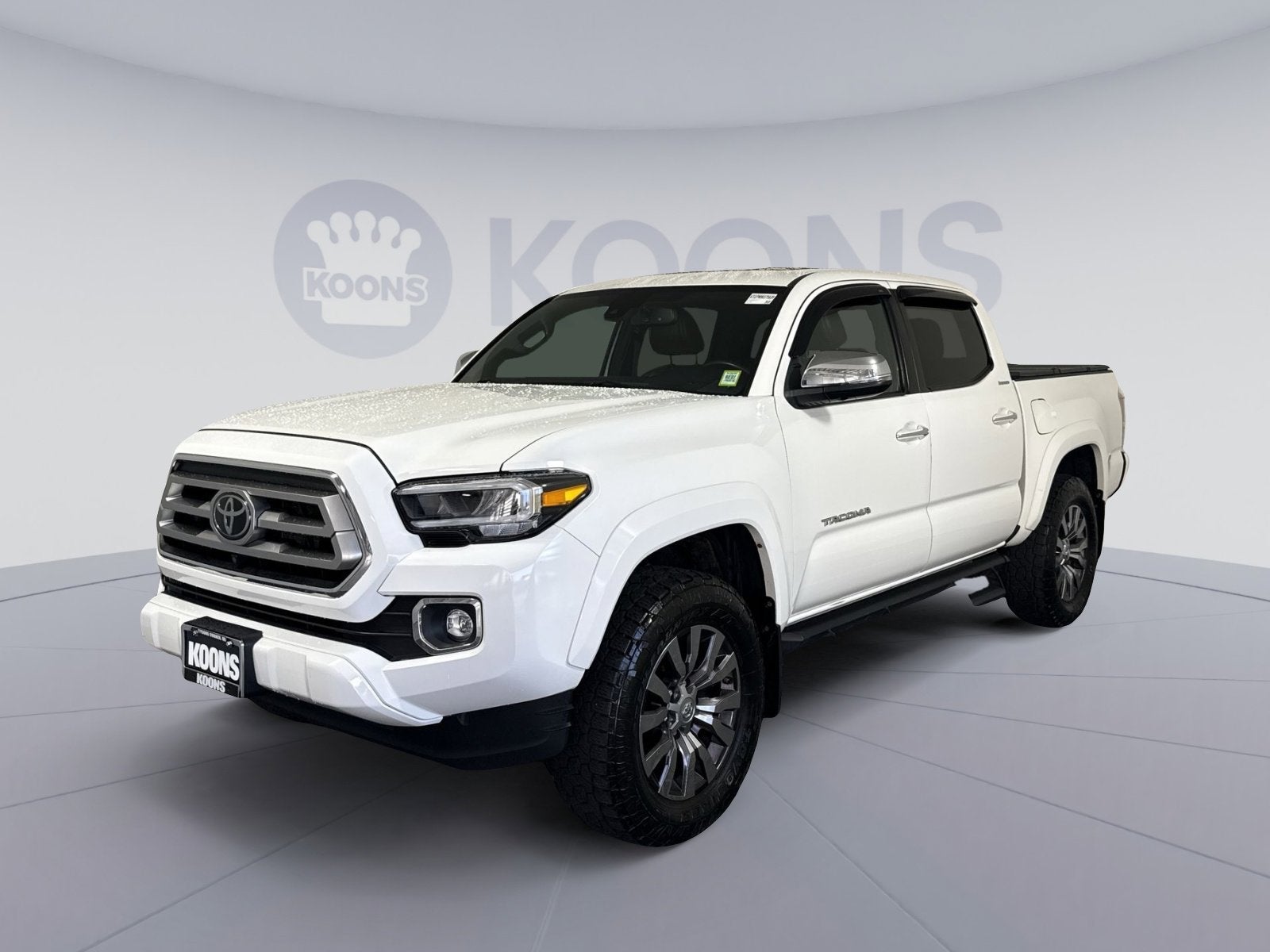 2021 Toyota Tacoma 4WD Limited in Super White — front three-quarter view