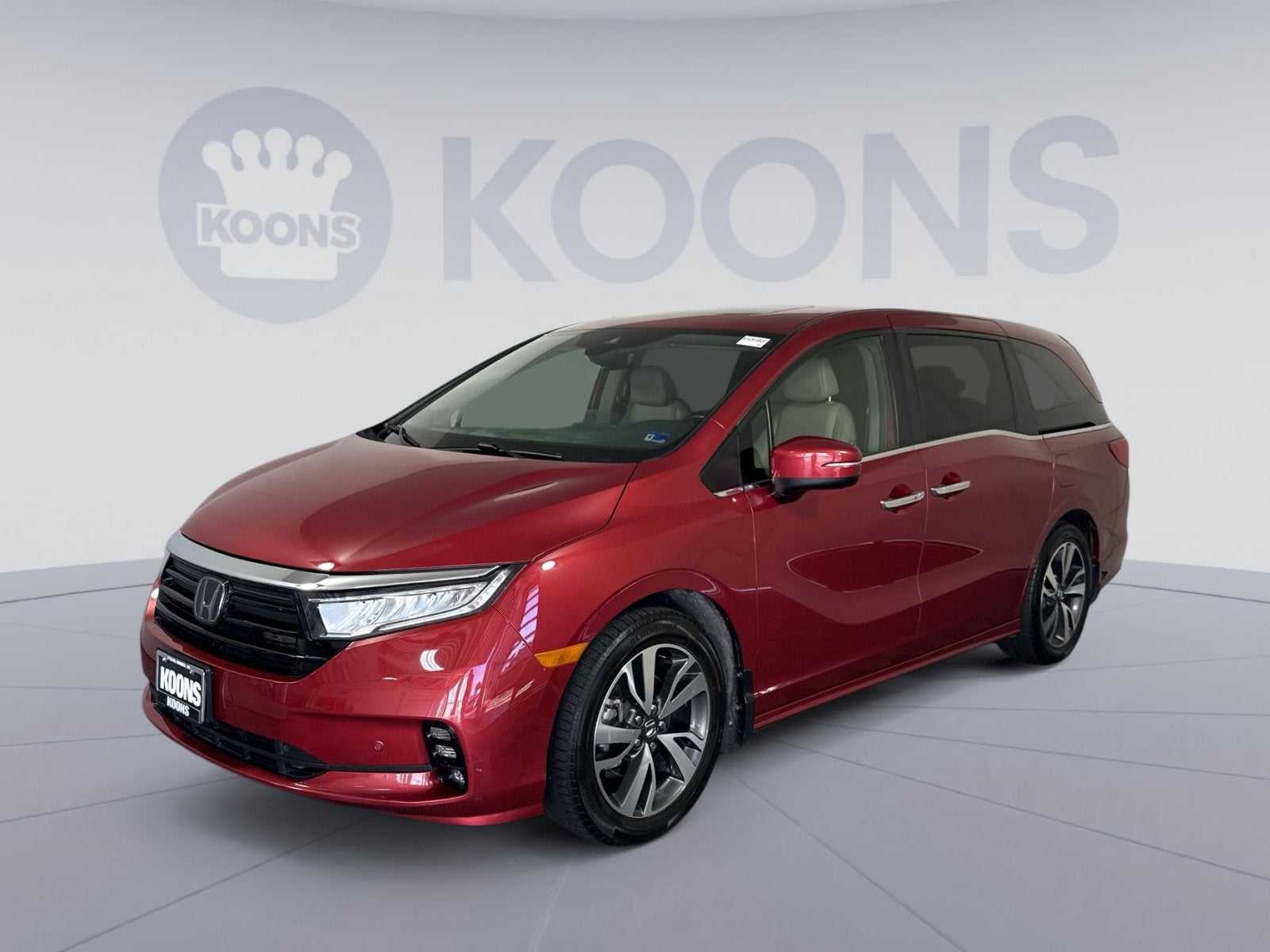 2024 Honda Odyssey Touring in Radiant Red Metallic II — front three-quarter view