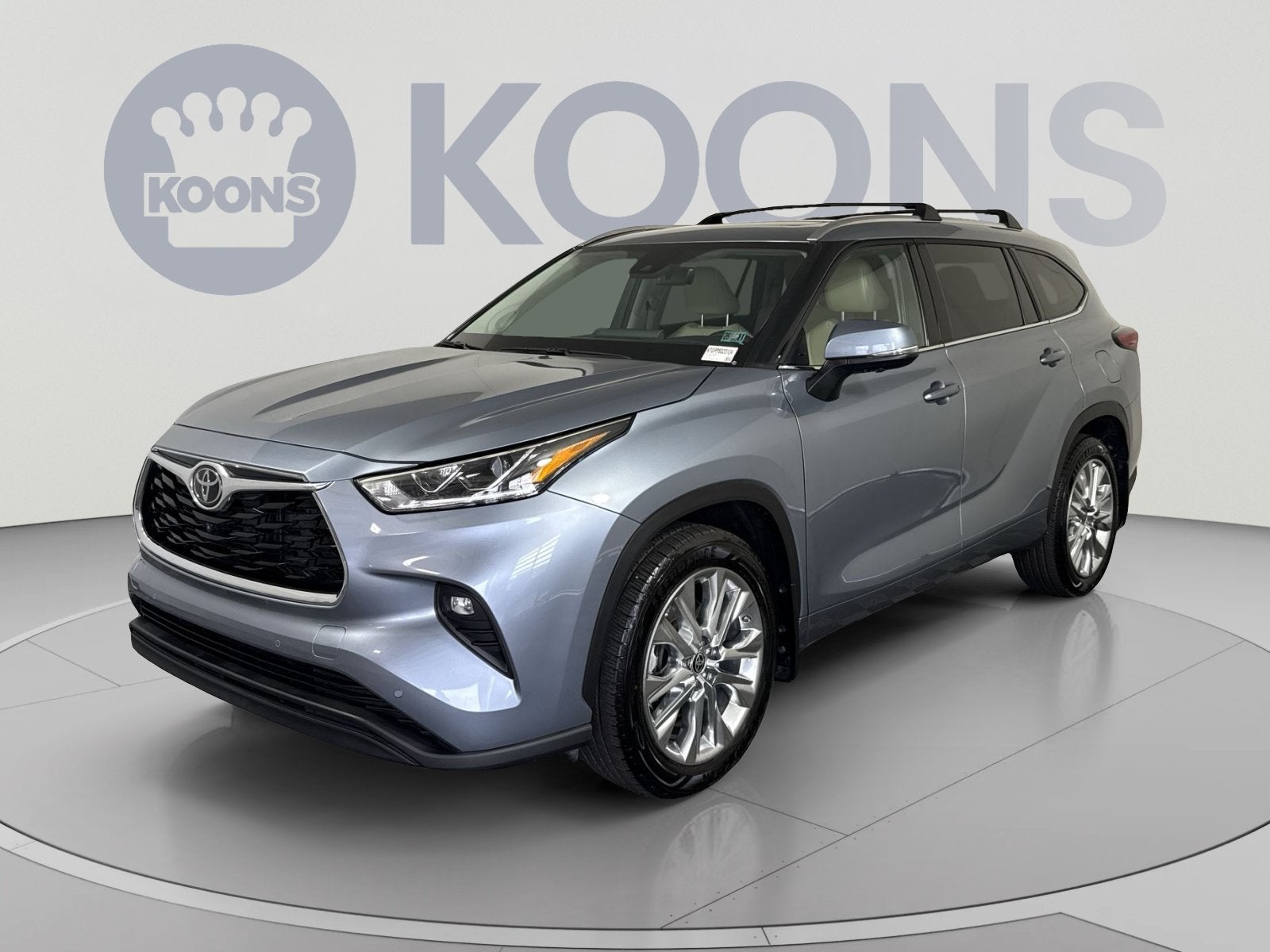2023 Toyota Highlander L in Moon Dust — front three-quarter view