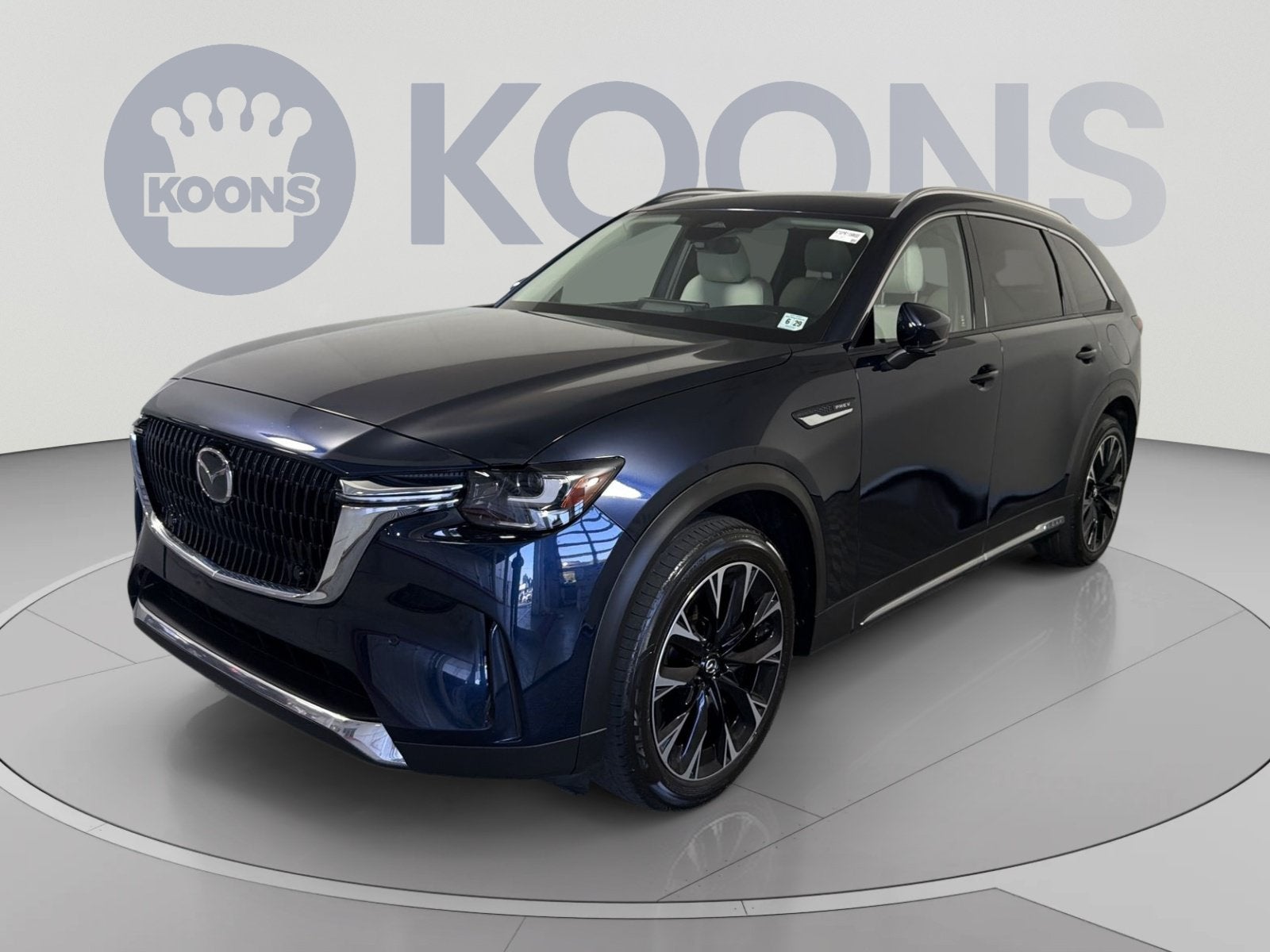 2024 Mazda Mazda CX-90 PHEV Premium Plus in Deep Crystal Blue Mica — front three-quarter view