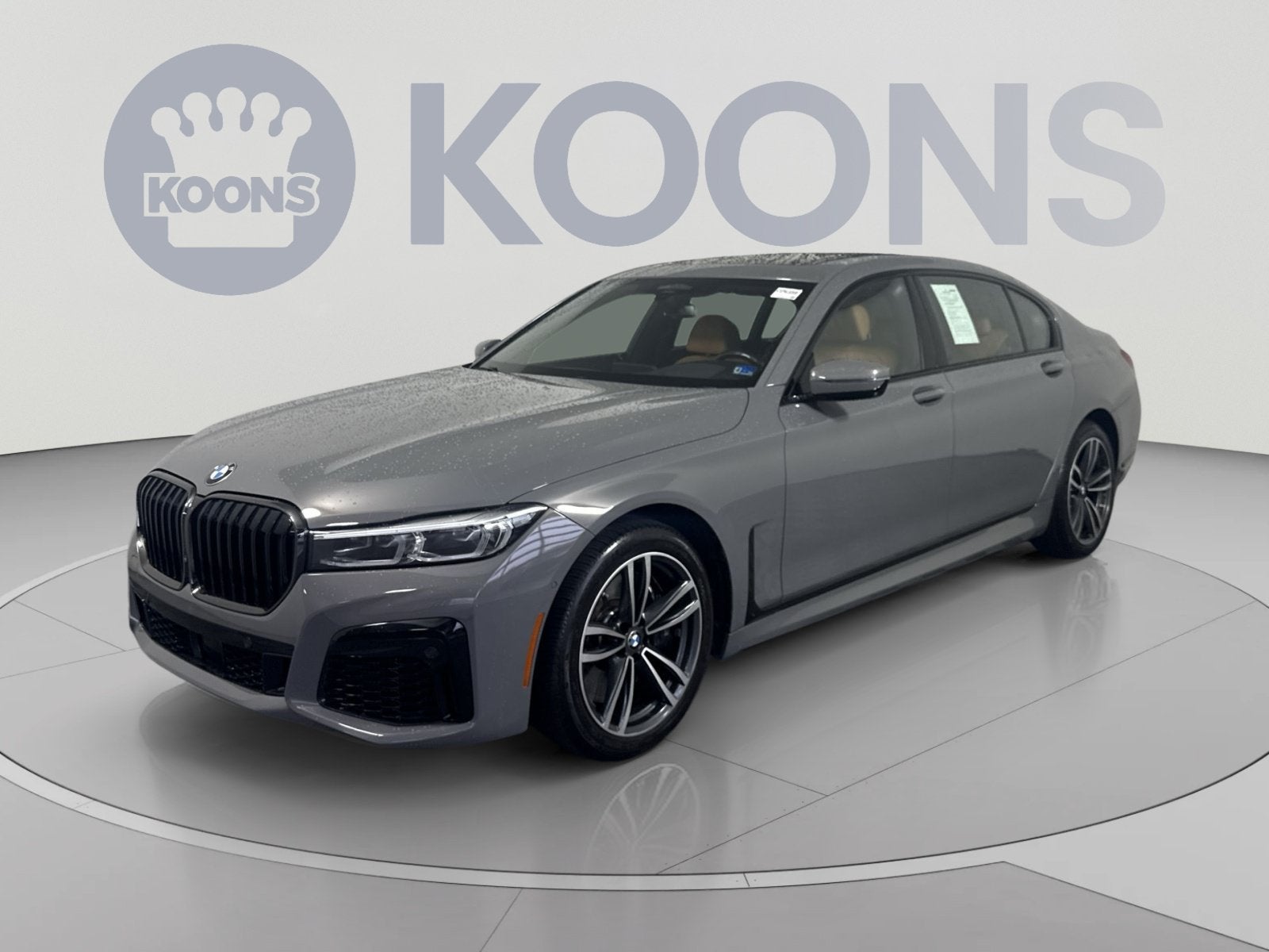 2022 BMW 7 Series 750i xDrive in Bernina Grey Amber Effect Metallic — front three-quarter view